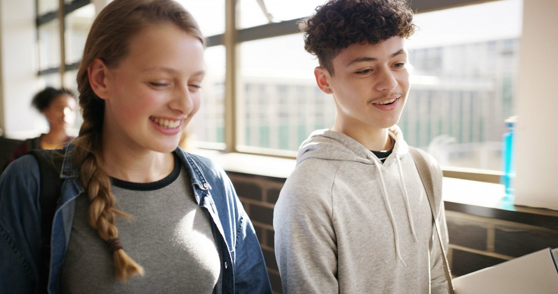 Boy,,Girl,And,Laugh,In,Hallway,At,High,School,With